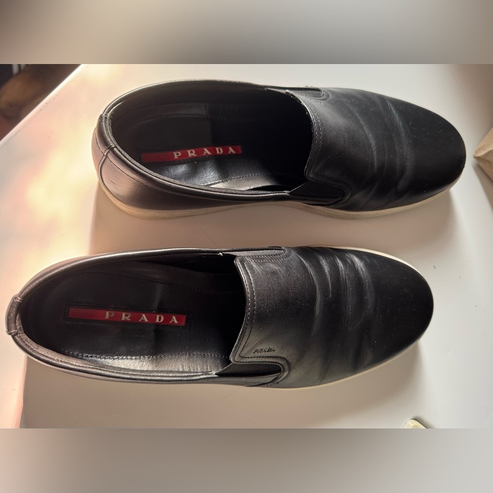 Prada Men's Black Slip-On Loafers..
Fit large I’m 10.5 - 11 and fit perfectly. - Picture 5 of 8